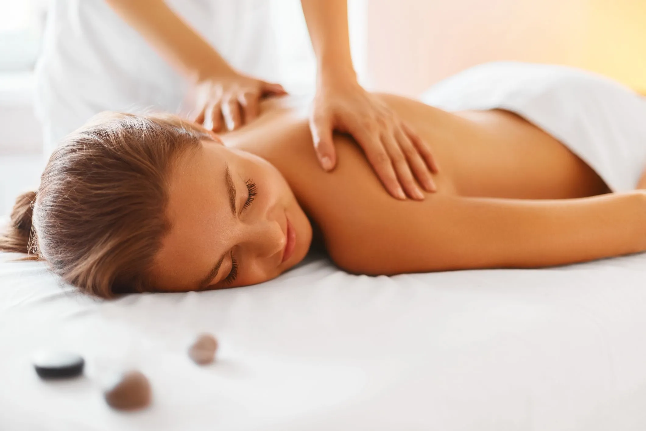 a women enjoying her massage at Revive